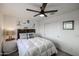 Bedroom featuring a ceiling fan, and framed artwork, with a sliding closet doors at 2158 N 212Th Ave, Buckeye, AZ 85396