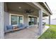 Relaxing covered patio featuring comfortable seating and smooth concrete flooring at 2158 N 212Th Ave, Buckeye, AZ 85396