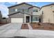 Charming two-story home with a well-manicured lawn and an attached two-car garage in a desirable neighborhood at 2158 N 212Th Ave, Buckeye, AZ 85396