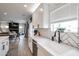 Modern kitchen seamlessly blends with the dining and living areas, perfect for entertaining and Gathering gatherings at 2158 N 212Th Ave, Buckeye, AZ 85396