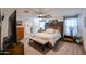 Spacious main bedroom with large bed, ceiling fan, ensuite bathroom and modern furnishings at 2158 N 212Th Ave, Buckeye, AZ 85396