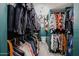 Walk-in closet with organized clothing racks, shelving, and plenty of storage space at 2158 N 212Th Ave, Buckeye, AZ 85396