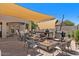 Entertain in the backyard with an outdoor kitchen, covered patio, fire pit, and comfortable seating at 21720 E Domingo Rd, Queen Creek, AZ 85142