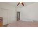 Bright bedroom with large closet, neutral paint, plush carpet, and cozy bedding at 21720 E Domingo Rd, Queen Creek, AZ 85142