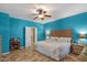 Bright bedroom with two windows, a ceiling fan, and tiled floors at 21720 E Domingo Rd, Queen Creek, AZ 85142