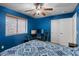 Inviting bedroom with a ceiling fan, blending comfort and functionality for a peaceful retreat at 21720 E Domingo Rd, Queen Creek, AZ 85142