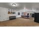 A versatile bonus room offering flexible space for recreation and entertainment purposes at 21720 E Domingo Rd, Queen Creek, AZ 85142