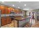 Modern kitchen with stainless steel appliances, updated cabinets, and a large island with bar seating at 21720 E Domingo Rd, Queen Creek, AZ 85142