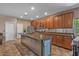 Modern kitchen with a large island, stainless steel appliances, and ample cabinet space at 21720 E Domingo Rd, Queen Creek, AZ 85142