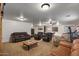 Expansive carpeted living room offering versatile layout options and comfortable seating arrangements at 21720 E Domingo Rd, Queen Creek, AZ 85142