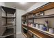 Efficient storage room featuring metal shelving, ideal for organization and maximizing space at 21720 E Domingo Rd, Queen Creek, AZ 85142