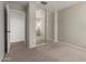 Cozy bedroom featuring mirrored closet doors and neutral carpet against light walls at 22544 W Mohave St, Buckeye, AZ 85326