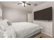 Cozy primary bedroom features a large television and natural light at 22544 W Mohave St, Buckeye, AZ 85326
