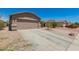 Charming single-Gathering home with a large two-car driveway and desert landscaping at 22544 W Mohave St, Buckeye, AZ 85326