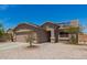 Charming single-Gathering home displaying solar panels, desert landscaping and a two-car garage at 22544 W Mohave St, Buckeye, AZ 85326