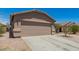 Charming single-Gathering home displaying a two-car garage with stone veneer accents at 22544 W Mohave St, Buckeye, AZ 85326