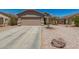 Charming single-Gathering home displaying a two-car garage and desert landscaping at 22544 W Mohave St, Buckeye, AZ 85326