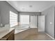 Bright bathroom featuring a soaking tub, separate glass-enclosed shower, and modern fixtures at 2306 W Spur Dr, Phoenix, AZ 85085