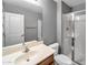 Bathroom with a shower and vanity, toilet, mirror, and good light at 2306 W Spur Dr, Phoenix, AZ 85085