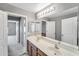 Bathroom with dual sinks and large mirror at 2306 W Spur Dr, Phoenix, AZ 85085