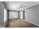 Bedroom featuring neutral carpeting, a ceiling fan, and a closet at 2306 W Spur Dr, Phoenix, AZ 85085