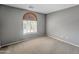 Cozy bedroom with carpet flooring and a window with blinds at 2306 W Spur Dr, Phoenix, AZ 85085