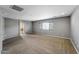 Large bonus room features carpet flooring and neutral paint at 2306 W Spur Dr, Phoenix, AZ 85085