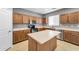 Well-equipped kitchen with an island, stainless appliances, and ample cabinet space at 2306 W Spur Dr, Phoenix, AZ 85085