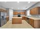 Spacious kitchen with ample cabinetry, island, and stainless steel appliances at 2306 W Spur Dr, Phoenix, AZ 85085