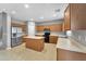 Functional kitchen featuring light countertops, a center island, and modern appliances at 2306 W Spur Dr, Phoenix, AZ 85085