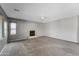 Large living room featuring plush carpeting, a fireplace, and ample natural light at 2306 W Spur Dr, Phoenix, AZ 85085