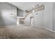 Open-concept living room with a staircase, neutral color palette, and abundant space at 2306 W Spur Dr, Phoenix, AZ 85085
