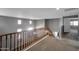 Interior staircase with railing and carpet flooring, leading to upstairs at 2306 W Spur Dr, Phoenix, AZ 85085