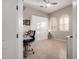 Bedroom with neutral colored walls, bright light, and desk with rolling chair at 23213 N Del Monte Dr, Sun City West, AZ 85375
