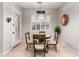 Cozy breakfast nook with a round wooden table, shuttered windows, and stylish lighting, creating a welcoming space at 23213 N Del Monte Dr, Sun City West, AZ 85375