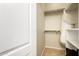 Walk-in closet with shelving and hanging racks for ample clothing storage at 23213 N Del Monte Dr, Sun City West, AZ 85375