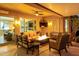 Comfortable covered patio featuring an outdoor seating area and a cozy fireplace at 23213 N Del Monte Dr, Sun City West, AZ 85375