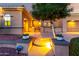 Exterior of the house with a lighted walkway, desert landscaping, and a secure security system at 23213 N Del Monte Dr, Sun City West, AZ 85375