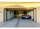 Spacious garage with built-in cabinets and a blue Corvette convertible at 23213 N Del Monte Dr, Sun City West, AZ 85375
