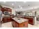 Gourmet kitchen with stainless steel appliances, granite countertops, and an island perfect for entertaining at 23213 N Del Monte Dr, Sun City West, AZ 85375