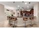 The kitchen bar offers pendant lighting and casual seating, perfect for enjoying a quick meal or socializing while cooking at 23213 N Del Monte Dr, Sun City West, AZ 85375