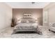 Relaxing main bedroom features a neutral palette, a plush bed, and ambient lighting at 23213 N Del Monte Dr, Sun City West, AZ 85375