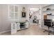 Home office with sliding barn door cabinet, workstation, and natural lighting at 23213 N Del Monte Dr, Sun City West, AZ 85375