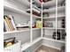 This large walk-in pantry provides plenty of shelving for storage of food items, small appliances, and more at 23213 N Del Monte Dr, Sun City West, AZ 85375