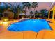 Beautiful pool featuring cascading water features and lush tropical landscaping at 23213 N Del Monte Dr, Sun City West, AZ 85375