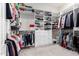 Spacious walk-in closet offers ample storage with built-in shelving and drawers at 23213 N Del Monte Dr, Sun City West, AZ 85375