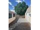 Outdoor space with desert landscaping and a covered patio at 235 N 61St Pl, Mesa, AZ 85205