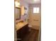 Bright bathroom with natural light and tub with grab bar at 235 N 61St Pl, Mesa, AZ 85205