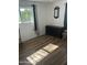 Cozy bedroom featuring natural light, a dark wood dresser, and neutral wall color at 235 N 61St Pl, Mesa, AZ 85205