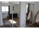 Spacious bedroom featuring natural light, and mirrored closet at 235 N 61St Pl, Mesa, AZ 85205
